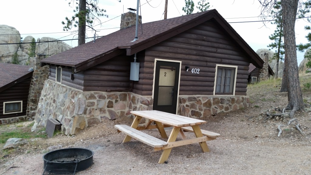 Sylvan Lake Lodge Cabin, picnic table, and fire pit.